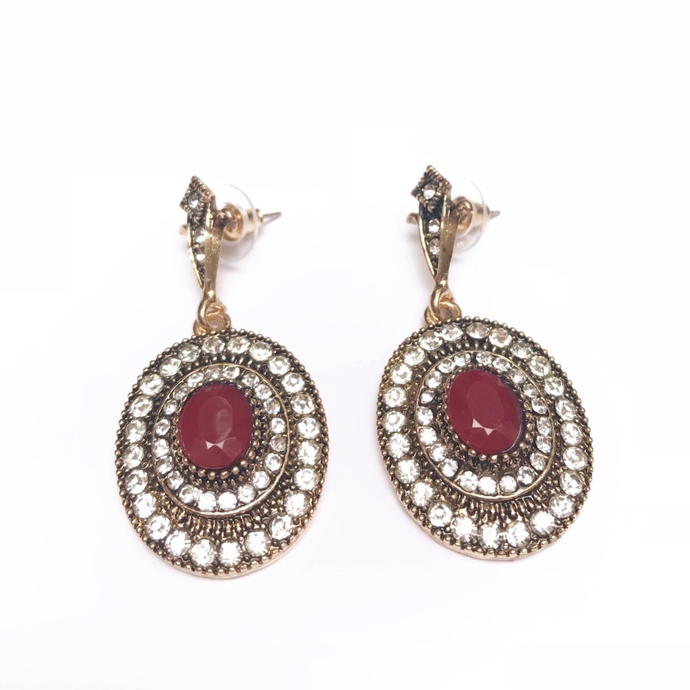 Gold/bronze earrings with rhinestones & red accent